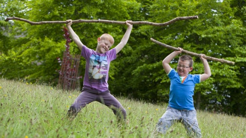 Children playing in the gardens at Knightshayes, Devon.